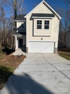 view of front of property with a garage