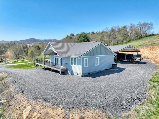 view of front of property with a wooden deck