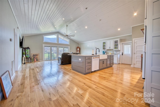 kitchen with ceiling fan, light wood-type flooring, gray cabinets, vaulted ceiling, and white dishwasher