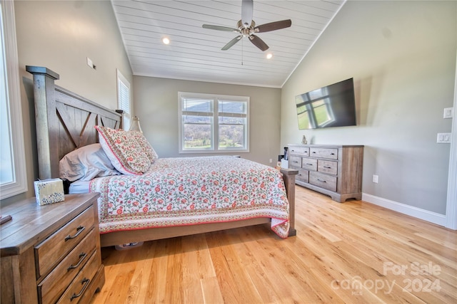 bedroom featuring lofted ceiling, ceiling fan, and light wood-type flooring