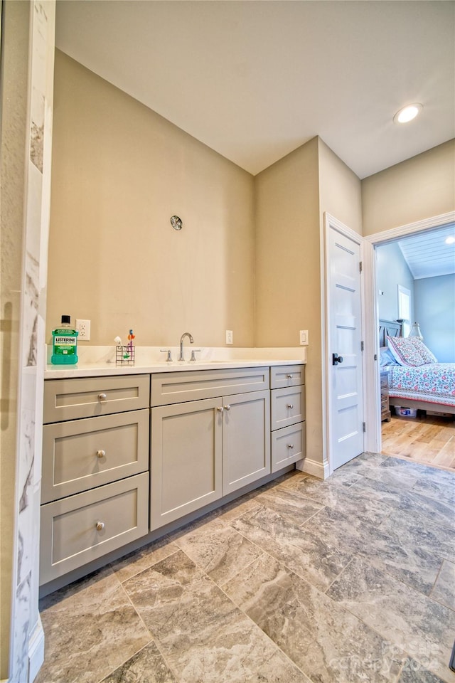 bathroom featuring tile flooring and vanity