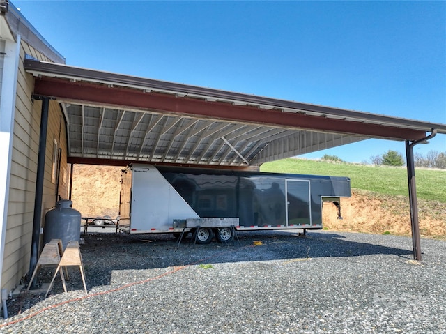 view of vehicle parking with a carport