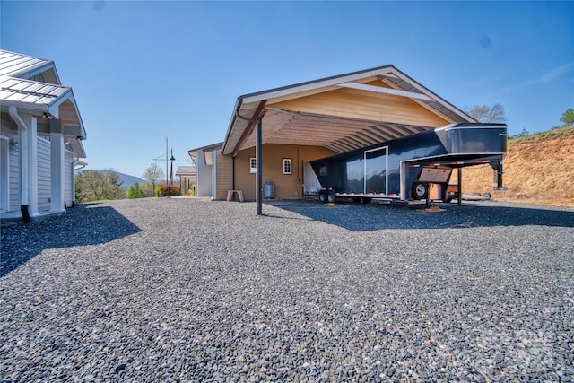 view of property exterior featuring a carport