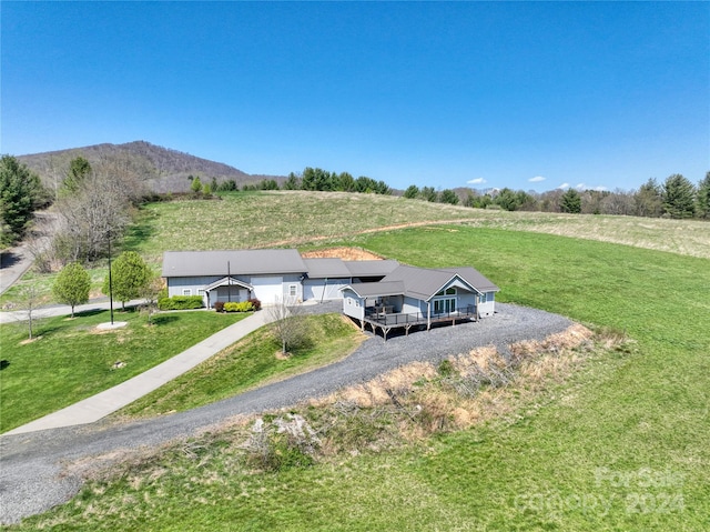 drone / aerial view featuring a mountain view and a rural view