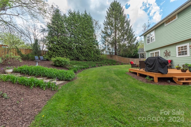 view of yard featuring a wooden deck