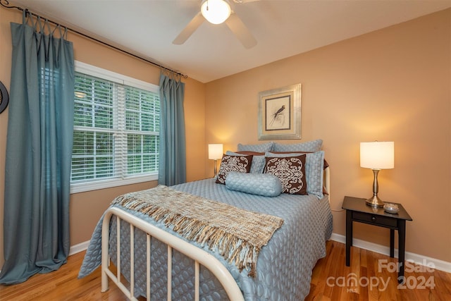 bedroom featuring wood-type flooring and ceiling fan