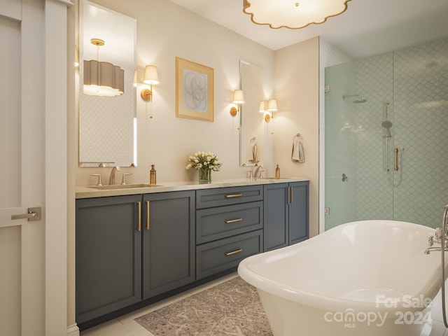 bathroom featuring tile flooring, dual vanity, and plus walk in shower