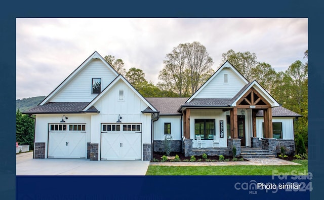 view of front of property with covered porch and a garage