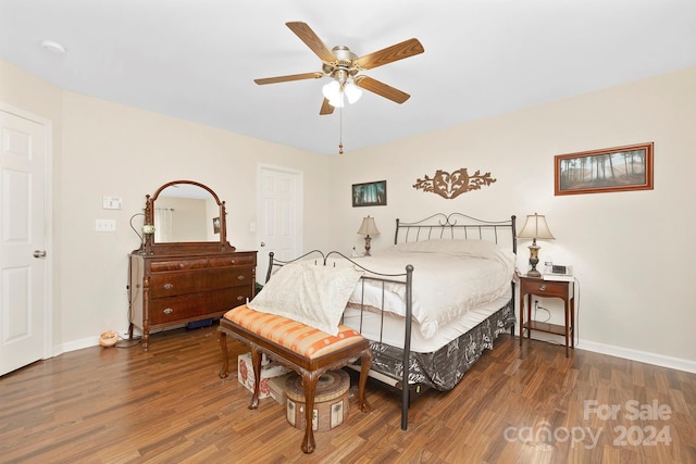 bedroom featuring ceiling fan and dark hardwood / wood-style floors