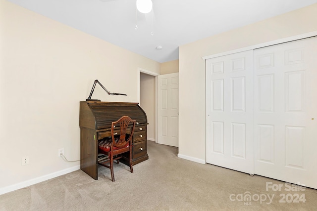 carpeted home office with ceiling fan