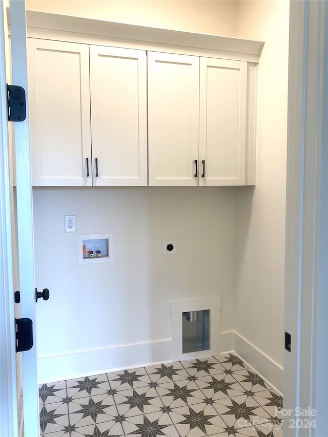 washroom featuring cabinets, hookup for an electric dryer, and hookup for a washing machine