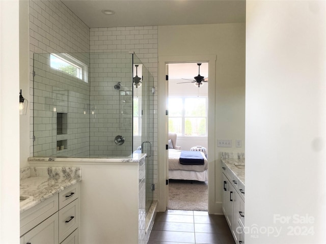 bathroom with vanity, tile patterned floors, a shower with door, and ceiling fan