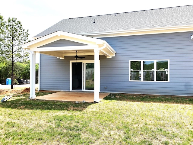 rear view of house with a yard, a patio area, and ceiling fan