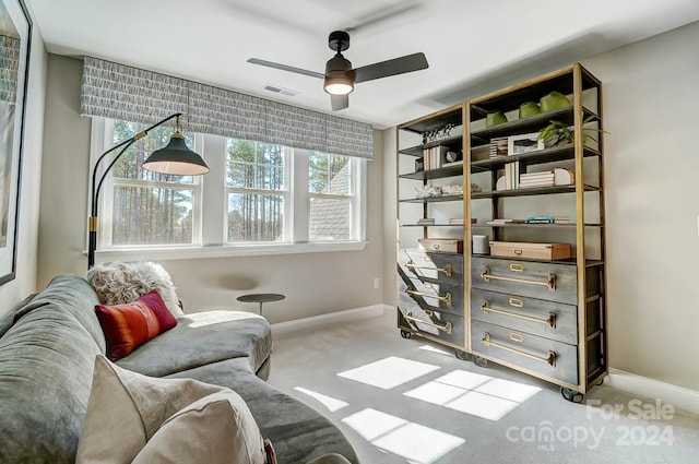 sitting room with light carpet and ceiling fan