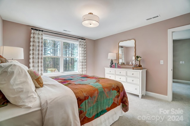 bedroom with light colored carpet