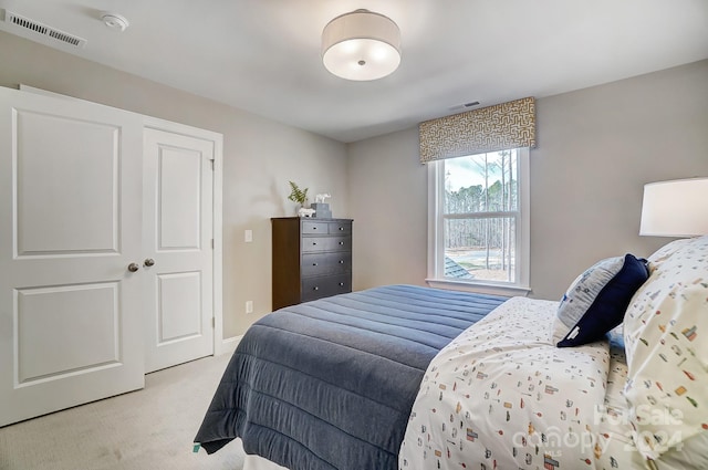 carpeted bedroom with a closet