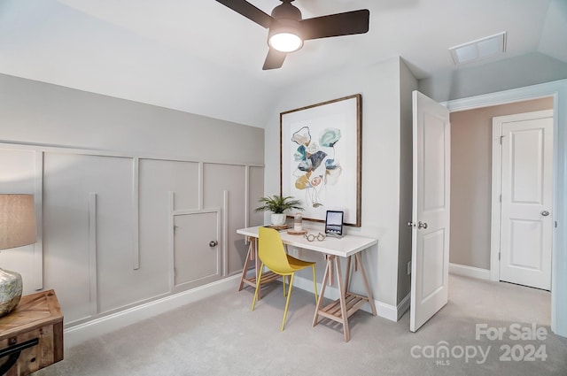 carpeted office with lofted ceiling and ceiling fan