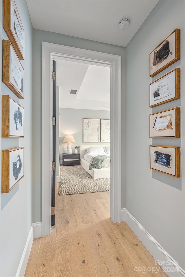 hall with light wood-type flooring