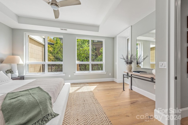 bedroom with ceiling fan and light wood-type flooring