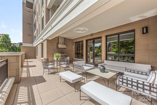 view of patio / terrace with a balcony and an outdoor hangout area