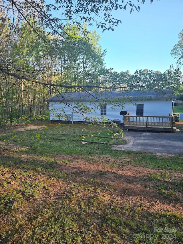 view of yard with a wooden deck