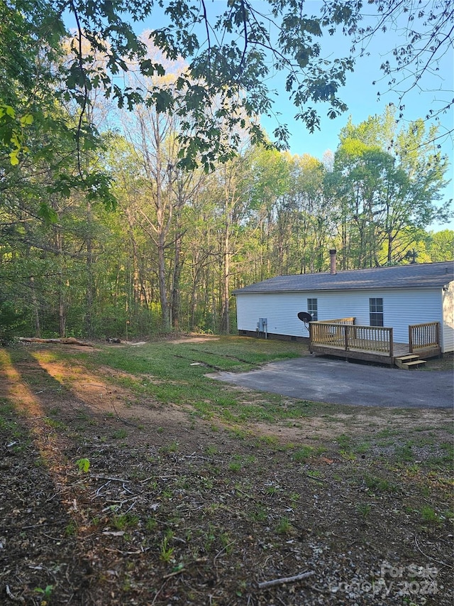 view of yard with a wooden deck