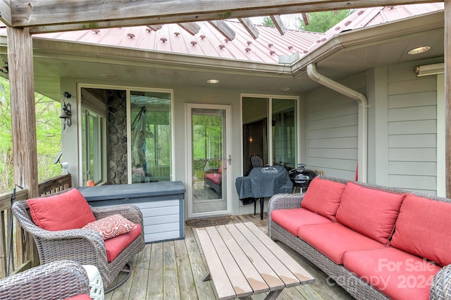 wooden terrace with an outdoor hangout area