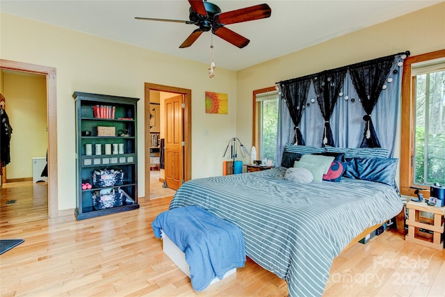 bedroom with ceiling fan and wood-type flooring