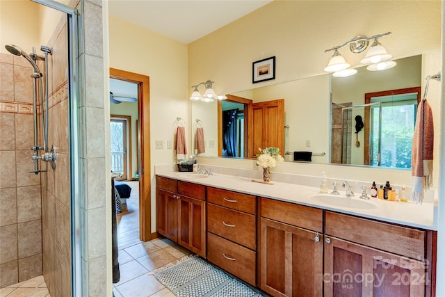 bathroom featuring tile patterned floors, vanity, and an enclosed shower