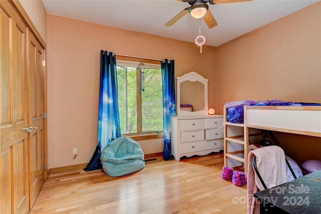 bedroom with ceiling fan and light hardwood / wood-style flooring