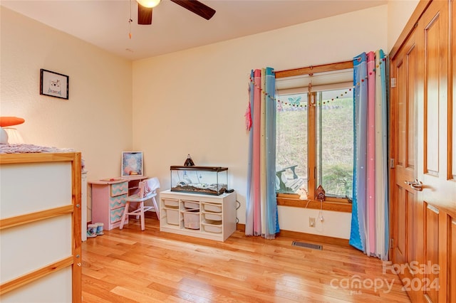 bedroom featuring ceiling fan and light hardwood / wood-style flooring