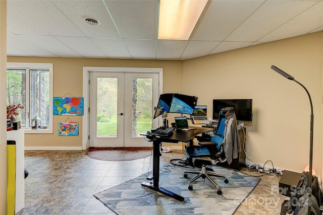 office featuring a healthy amount of sunlight, tile patterned floors, and french doors