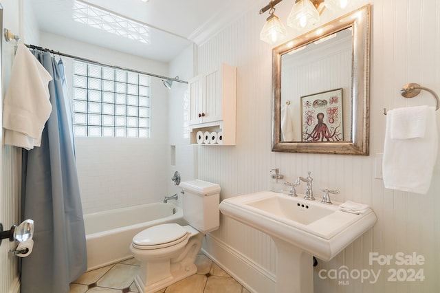 bathroom featuring shower / tub combo with curtain, toilet, and tile flooring