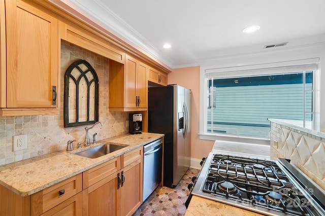 kitchen featuring light stone countertops, appliances with stainless steel finishes, crown molding, tasteful backsplash, and sink