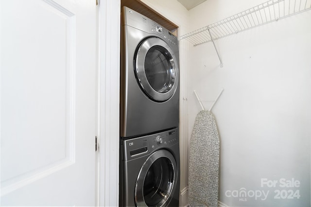 laundry area featuring stacked washer and dryer