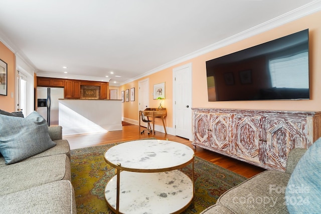 living room featuring ornamental molding and dark wood-type flooring