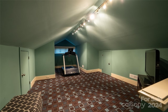 additional living space featuring vaulted ceiling