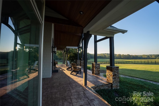 view of patio / terrace with a rural view