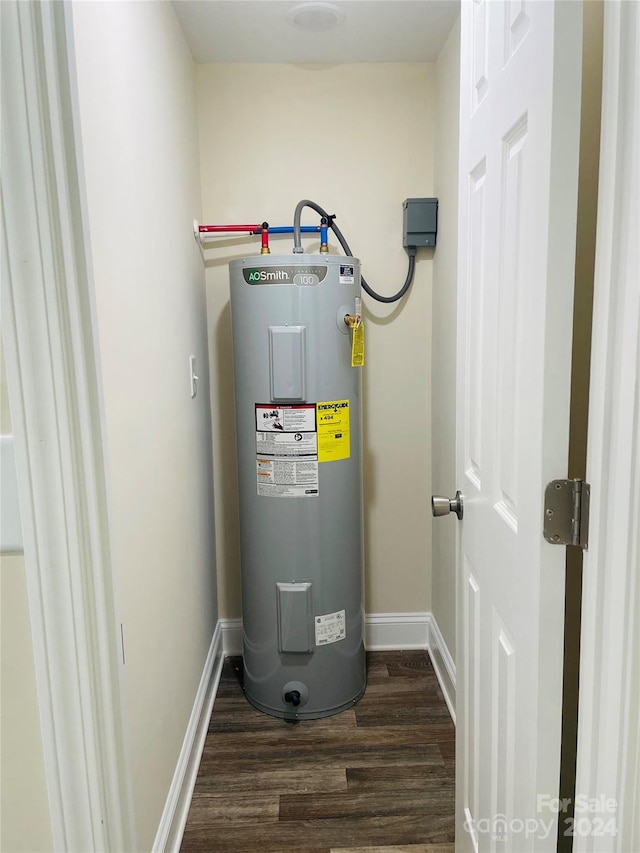 utility room featuring electric water heater