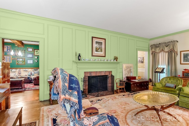 living room featuring a fireplace and wood-type flooring