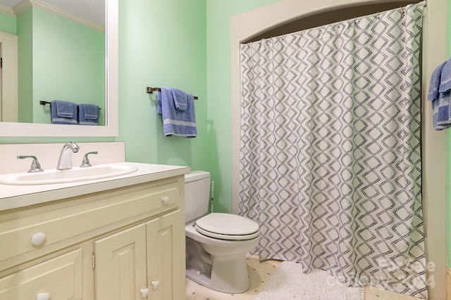 bathroom with crown molding, large vanity, and toilet