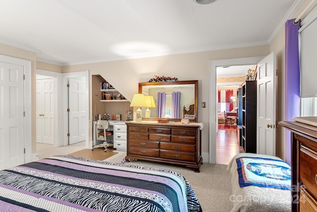 carpeted bedroom featuring crown molding