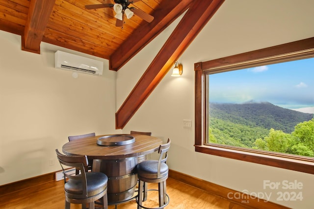 dining area featuring an AC wall unit, wooden ceiling, light wood-type flooring, and ceiling fan