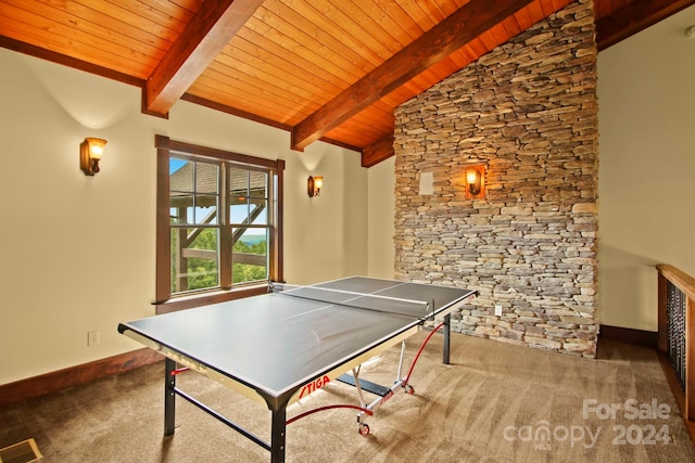 playroom with carpet, vaulted ceiling with beams, and wooden ceiling