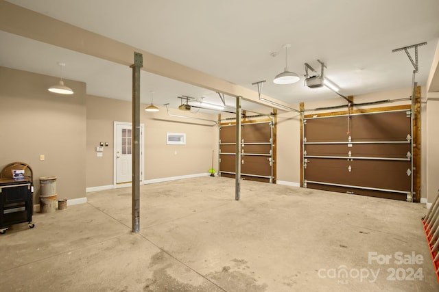 691 Dogwood Ln, Blowing Rock, NC 28605 - garage featuring a garage door opener