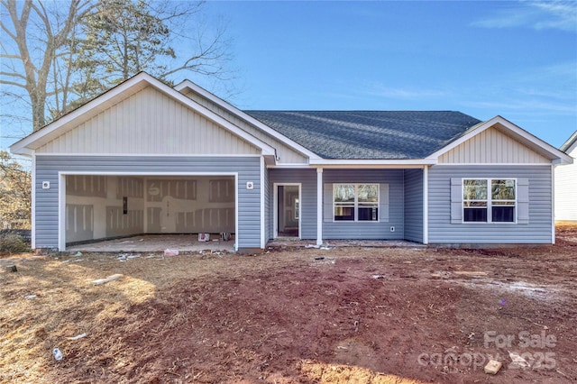 single story home featuring a garage