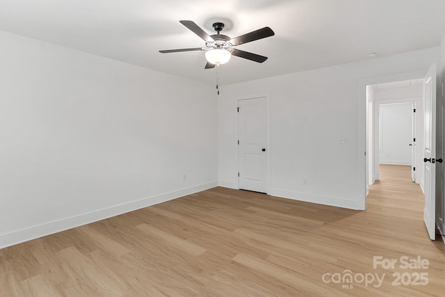 unfurnished room featuring light hardwood / wood-style flooring and ceiling fan