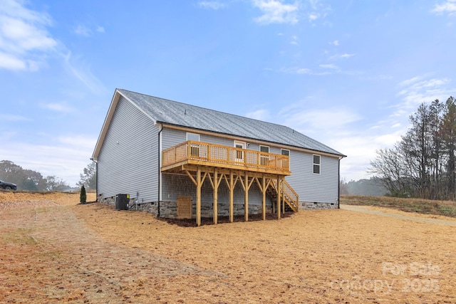 back of property with central air condition unit and a deck