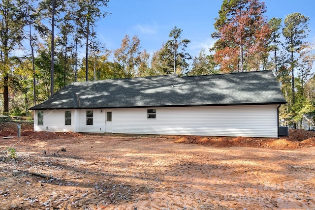 rear view of property featuring central air condition unit