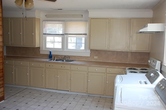 kitchen with ceiling fan, range, washer / dryer, and tasteful backsplash